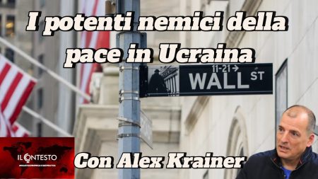 Un'insegna di Wall Street appare mentre il testo italiano parla della guerra russo-ucraina e delle opinioni di Alex Krainer sulla pace.