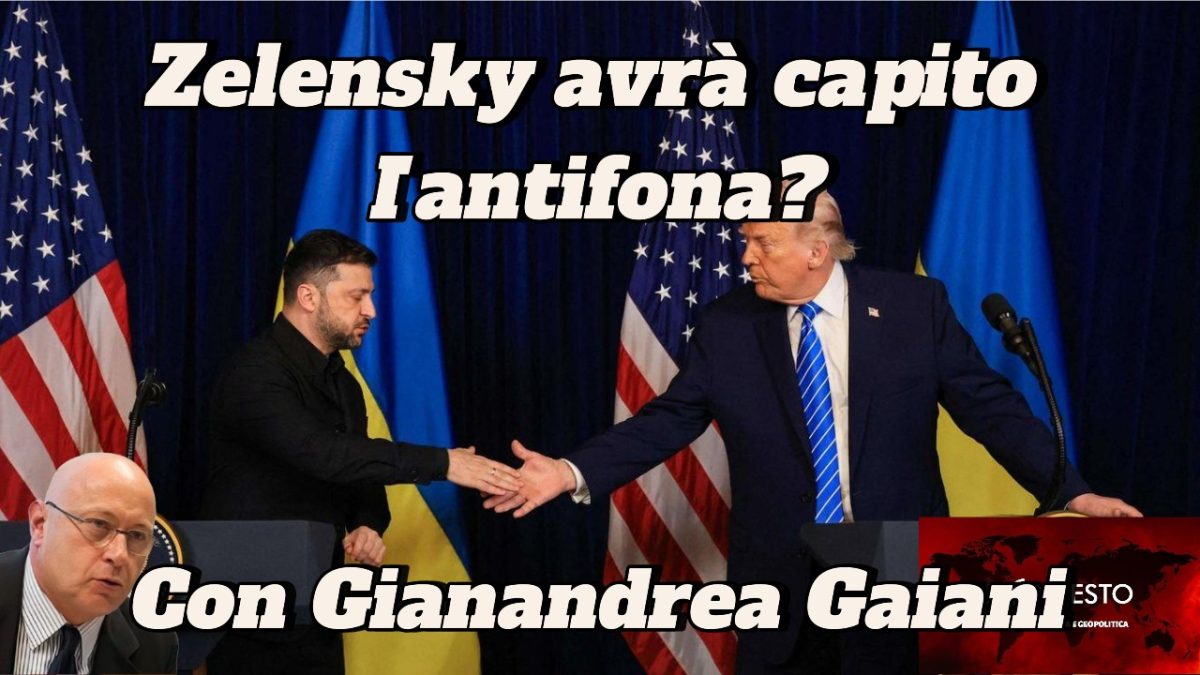 Il presidente Zelensky avrà capito l’antifona? Volodymyr Zelensky e Donald Trump si stringono la mano su un podio, con Viktor Orban in mezzo a bandiere statunitensi e ucraine.